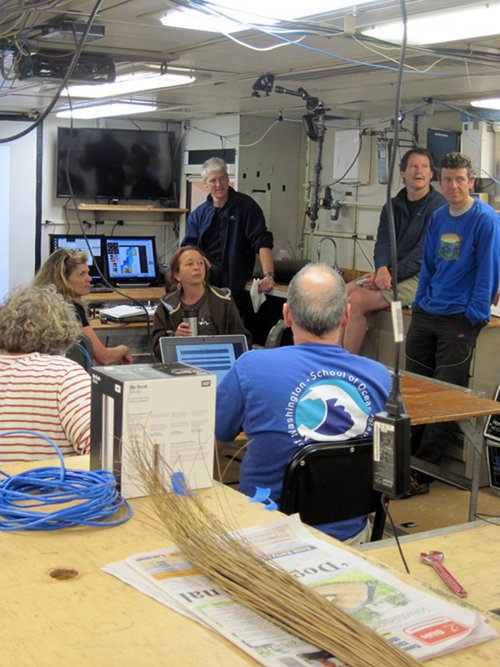 The science team meets with the ROV team to discuss video and navigation displays for the Quest 4000 ROV.
