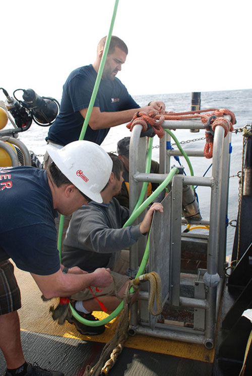 The ROV crew attempts to seal off the umbilical tear and brace the weak point at the pressor.