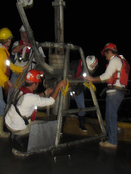 Ship crew and science crew work together to bring heavy sampling devices, such as this loaded box core, onboard safely, whether it is the ROV, box cores, CTDs, or trawl nets. Cooperation and care is essential for both safety of the crew and equipment and viability of the samples.