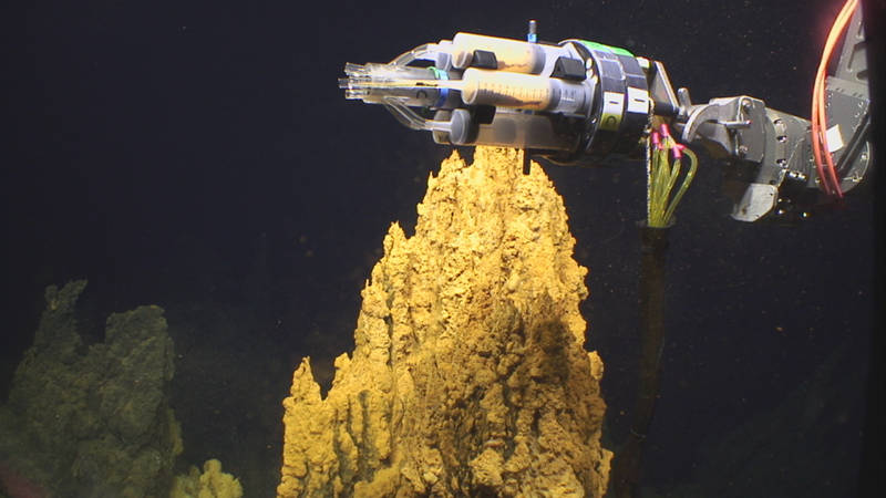 While at the Urashima vent site, the Jason manipulator arm holds the Bio-mat Sampler.