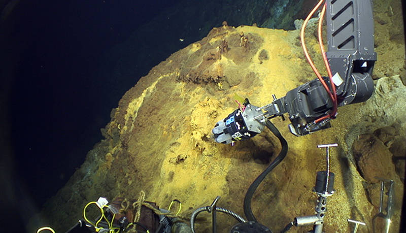 Jason takes a sample of with the BioMat sampler at a location on NW Eifuku called Yellow Cone.