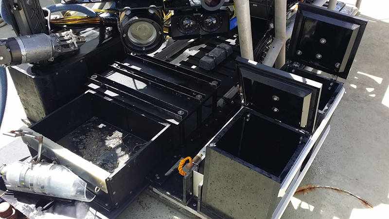 The ROV once it hits the deck and the scientists descend upon it to collect all of the samples recovered from bottom.