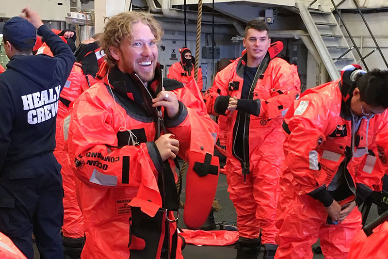 Matthew Broughton participates in safety drills by doning a life-saving Mustang suit.
