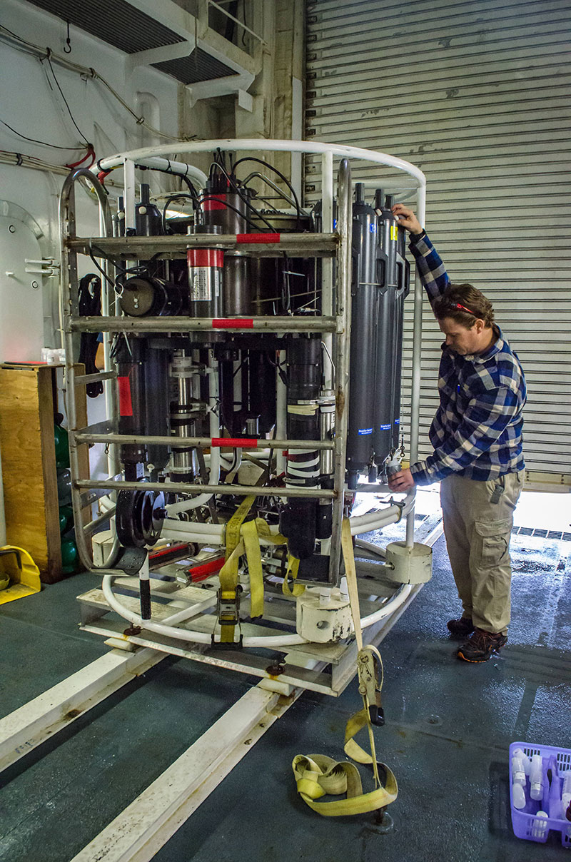 Peter Shipton collects water samples from the niskin bottles on the CTD. All 20 niskin bottles take water samples from various depths, starting near the seafloor and ending close to the surface.