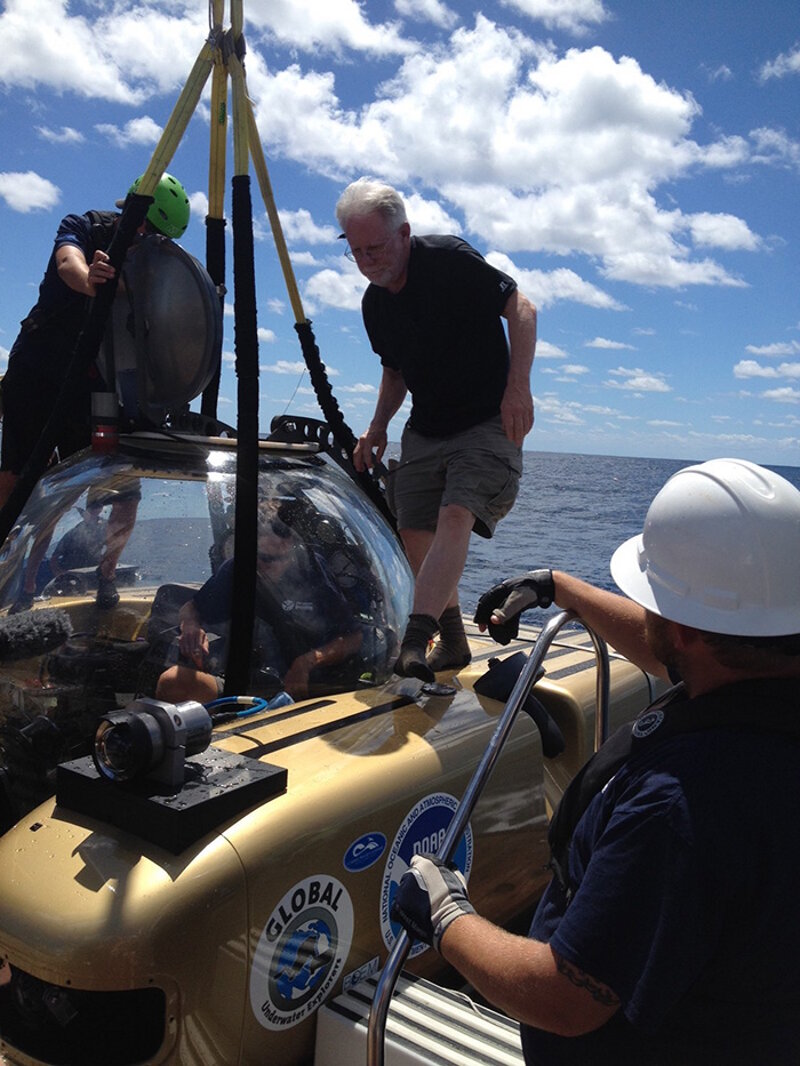 Mike Ruane, Washington Post staff writer, enters the manned submersible for a dive to the wreck sites.