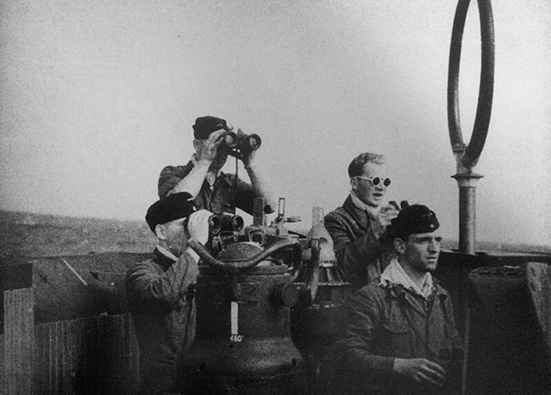 Crew of U-576 at watch in the conning tower. “The men of the gray boats came together from all areas of the Reich to form one colorful German whole, linked together and working in sync. Our crews are like the sword wielding brotherhoods of the Viking age.” Hunt in the Atlantic by H. Busch.