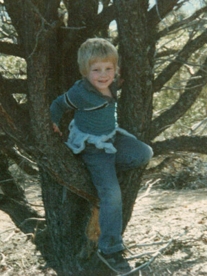 Carl climbing a tree as a child.