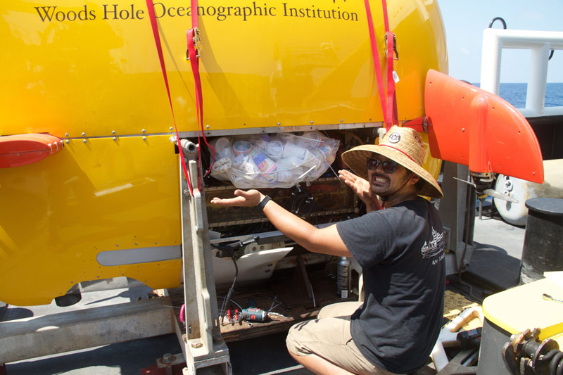Justin Fujii secures the full-size cups inside the middle compartment of the AUV Sentry.