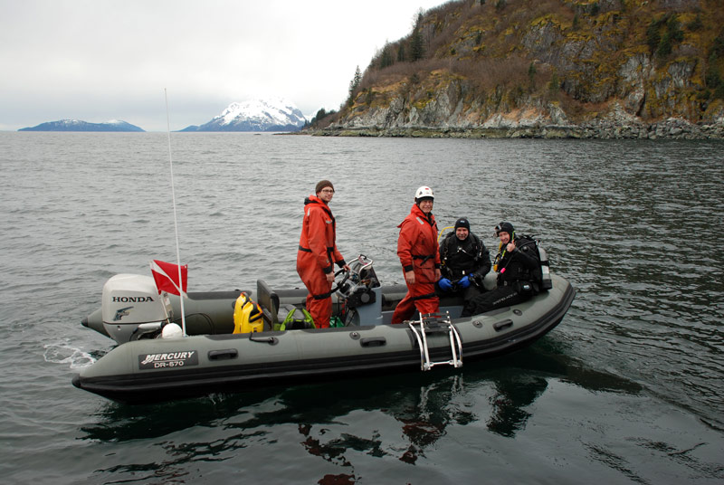 Divers Amanda Kelley and Jeff Godfrey prepare for an exploratory dive with dive tender Rod Catanach and RHIB captain Nathaniel Charbonneau.