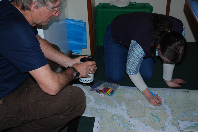 Rhian Waller and Dann Blackwood work on developing a map with all of dive sites so far.