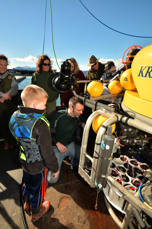 A group of visitors are shown the ROV by Kevin Joy during the open house in Bartlett Cove.