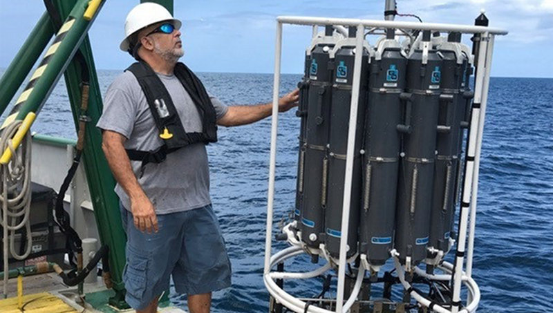 Figure 3. Denis Ilias, University of Miami, Marine Technician is launching the CTD rosette.