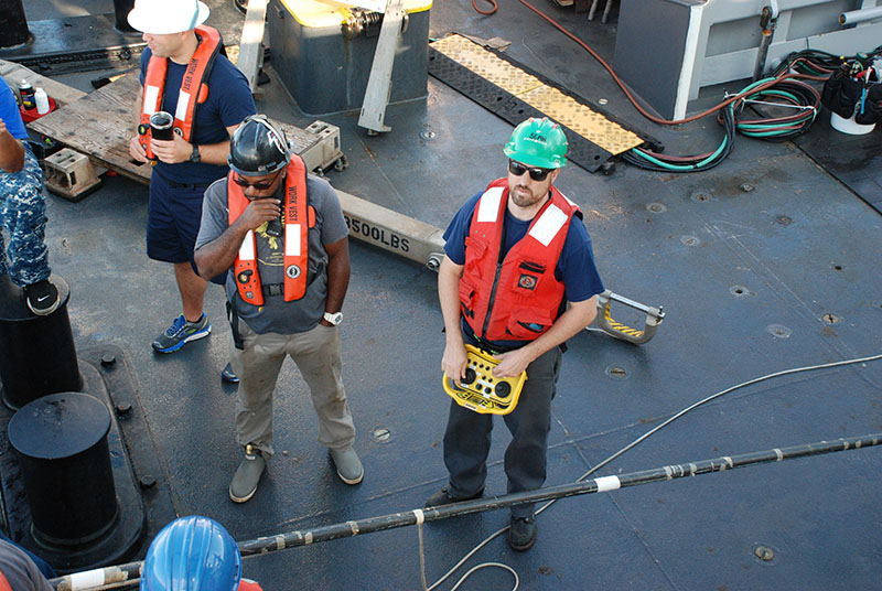 Sentry expedition leader Sean Kelley remotely drives the AUV toward the ship after surfacing. Once within range, it will be connected to the ship’s crane and lifted back on board.
