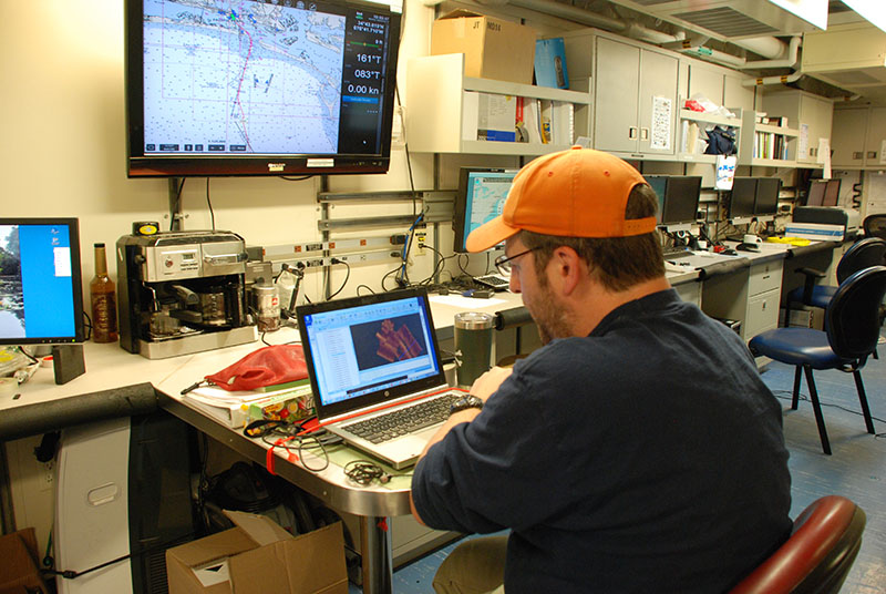 U.S. Geological Survey geologist Jason Chaytor processes sidescan data from a recent AUV Sentry dive. These data will help us to better understand the seafloor environment and plan for future DEEP SEARCH expeditions.