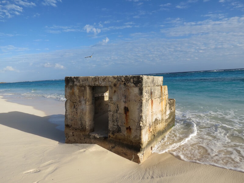 A pillbox remains in the sand at Eastern Island at Midway Atoll.