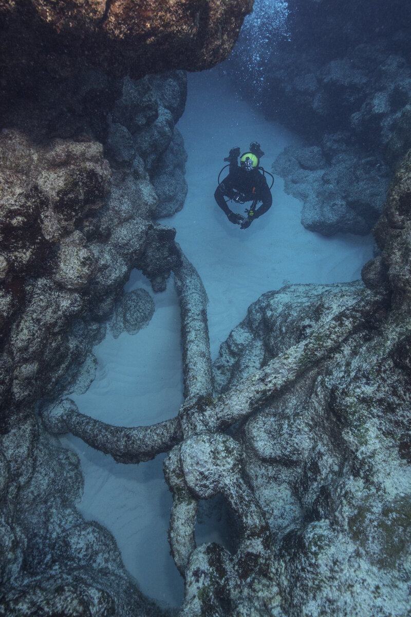 Jason Leonard examines the discovered anchor outside the reef during yesterday’s anomaly diving.