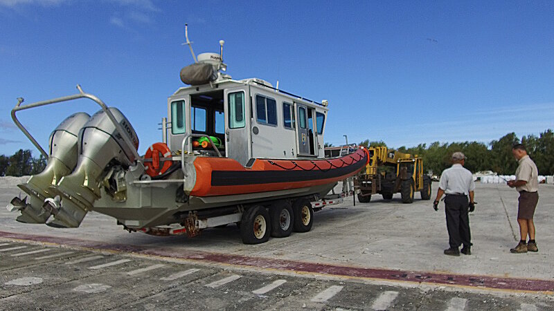 The team getting the boat ready to get in the water for survey at Midway Atoll.