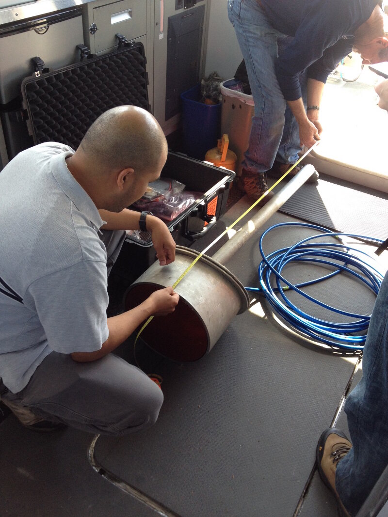 NOAA researchers measure offsets for a sonar mount, a critical step for ensuring correct positioning the of sonar information collected on the water. The navigation system, which is located apart from the sonar sensor, must know the distances between the two in order to adjust positions and account for the motion of the sonar sensor as the boat pitches, rolls, and moves through the water. Source: Thunder Bay National Marine Sanctuary/NOAA.