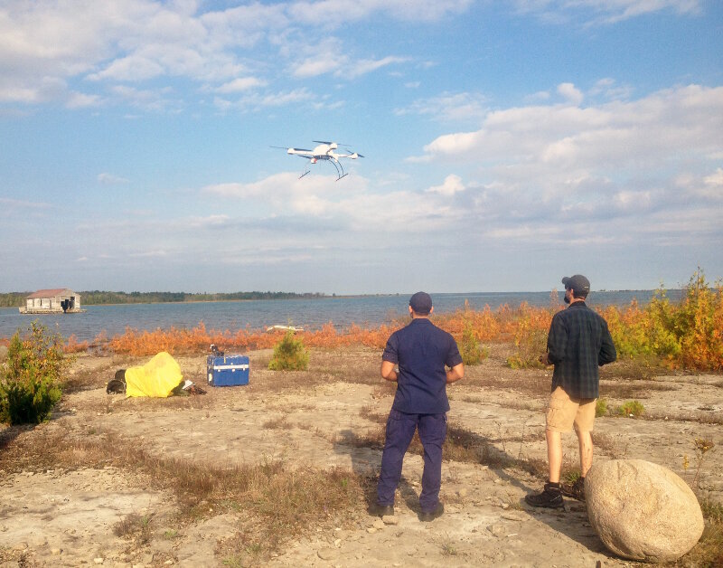 An UAS takes off from Thunder Bay Island under the supervision of its pilots.