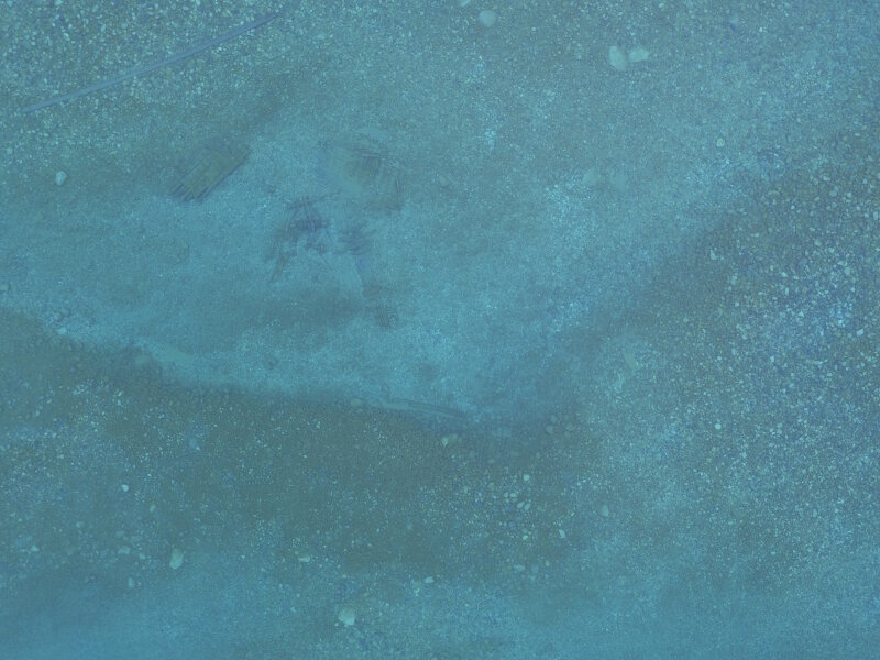 Sample image taken during a survey mission over North Point Reef. The remains of a wooden vessel can be seen, and belong to archaeological site Galena which is buoyed by the sanctuary every summer. The mooring buoy tackle, a large train wheel, is also visible in the image