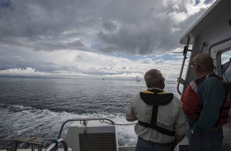 MTU’s Dr. Guy Meadows and Michael Beaulac, from the State of Michigan’s Office of the Great Lakes, look out over the waters off Presque Isle as R/V Storm transits to the survey area.