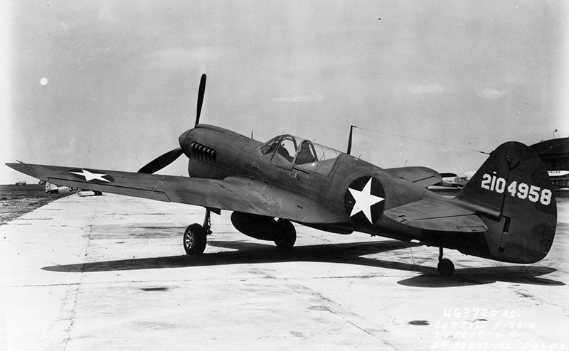 The P-40F Warhawk, built by Curtiss-Wright Corporation, was the first pursuit or fighter aircraft flown by Tuskegee airmen training in Michigan.
