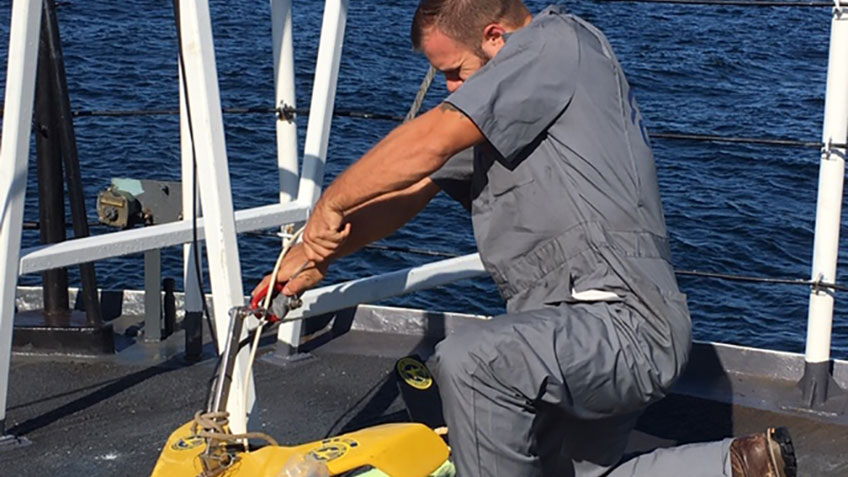 John Bright makes needed modifications to the sidescan instrument. John Bright makes needed modifications to the sidescan instrument.