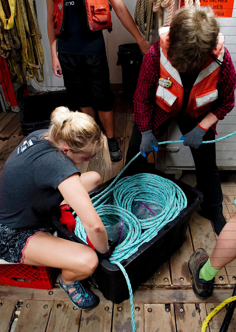 Recovering the Medusa requires a lot of line handling. Here, Heather Bracken-Grissom and Edie Widder coil line being pulled in by the capstan.