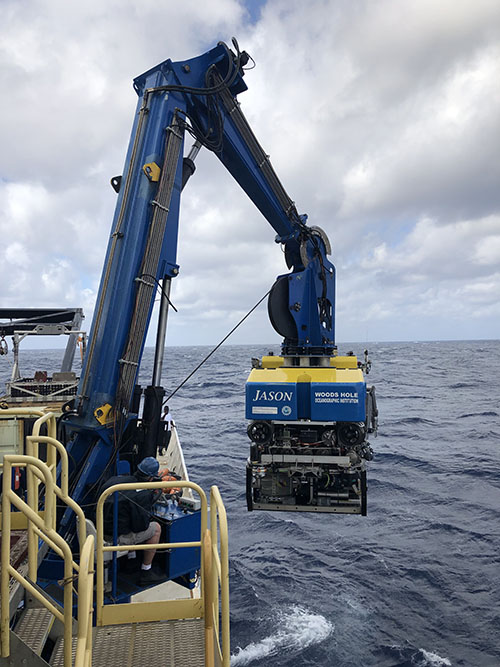 ROV Jason is recovered onboard NOAA Ship Ron Brown using a specialized crane and winch system that travels with the ROV.