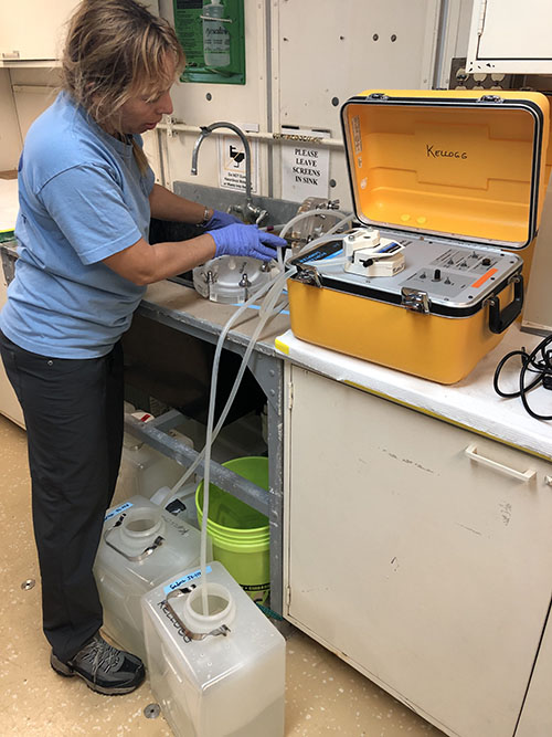 Christina Kellogg uses a peristaltic pump to circulate the water through a filtration device. The filter will collect all of the microbes in the water sample, which Chris will then further analyze when she’s back on land.