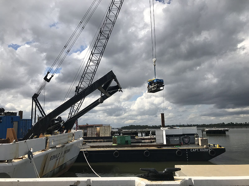 ROV Jason is carried by the barge crane to its position on the port side of the aft deck.