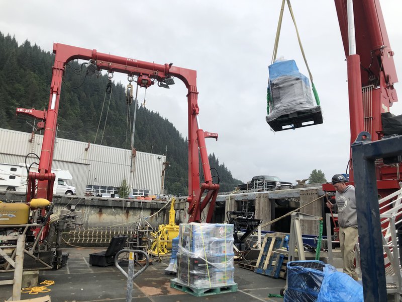 Sikuliaq being loaded with science gear.