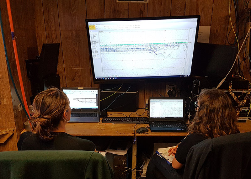 Evans (left) and Metcalfe (right) monitor acquisition of the parametric sonar data onboard the R/V Nikola.