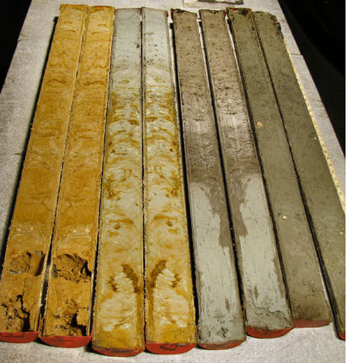 A split core, recovered in 2010, shows the transition from modern marine sediment (top right), through the Pleistocene clay (lower left).