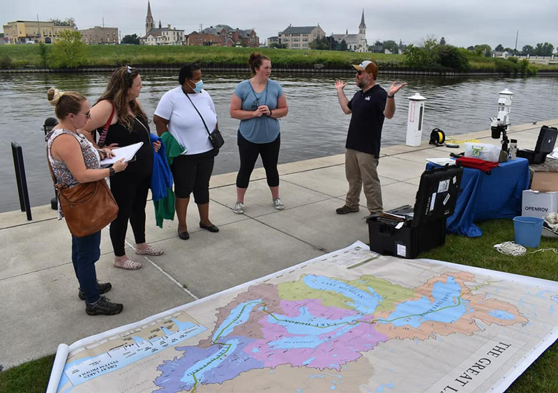 University of Wisconsin Sea Grant biologist Titus Seilheimer talks about Lake Michigan’s natural environment with a group of Wisconsin educators. Image courtesy of Wisconsin Maritime Museum.