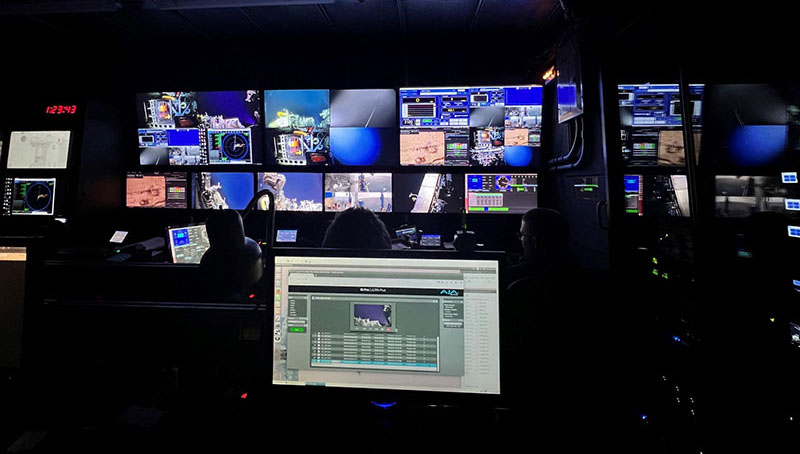 The remotely operated vehicle control room with its many monitors busy displaying live video from the seafloor during the Escanaba Trough: Exploring the Seafloor and Oceanic Footprints expedition.
