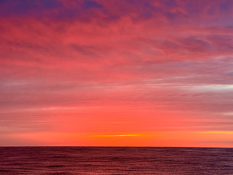 A brilliantly colorful sunrise greeted the Escanaba Trough: Exploring the Seafloor and Oceanic Footprints expedition team on the morning of June 7.