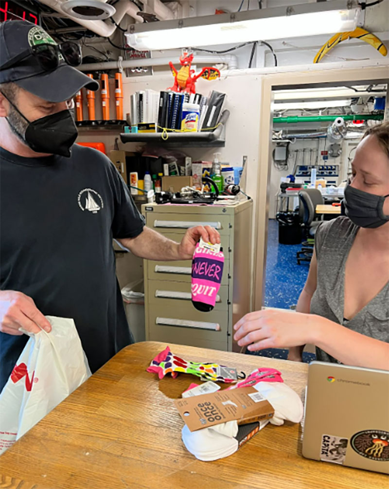 Erik Cordes bought Madeline Evanson all sorts of fun socks in Old San Juan, Puerto Rico, before the ship left port for the Illuminating Biodiversity in Deep Waters of Puerto Rico 2022 expedition since she forgot all of hers at home!