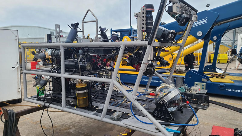 The low-light camera (glass sphere on right side of image) mounted on remotely operated vehicle Global Explorer that will be used to enable a less-intrusive study of midwater organisms and the collection of imagery of bioluminescent organisms during the Illuminating Biodiversity in Deep Waters of Puerto Rico expedition.