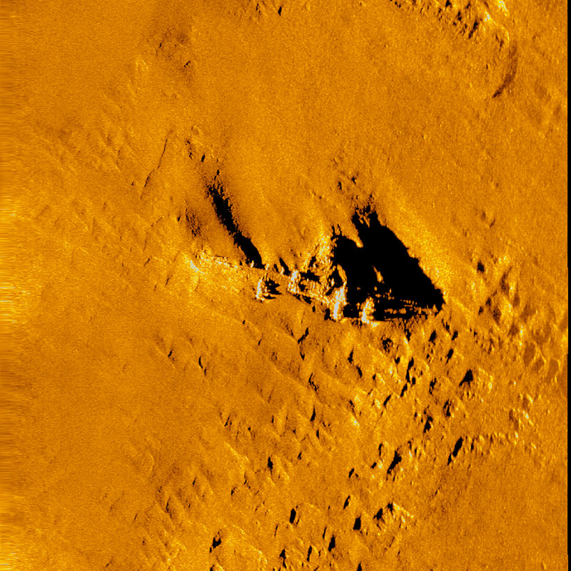 During the Deepwater Surveys of World War II U.S. Cultural Assets in the Saipan Chanel expedition, the team explored the site of the B-29 aircraft lost in World War II near Tinian Island that was discovered during a NOAA Ocean Exploration expedition in 2016. This side scan sonar image generated from data collected during the current expedition shows the aircraft.