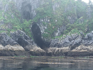Caves on the shoreline of Divers Island off the west coast of Dall Island, seen during the first year of fieldwork for the Our Submerged Past expedition.
