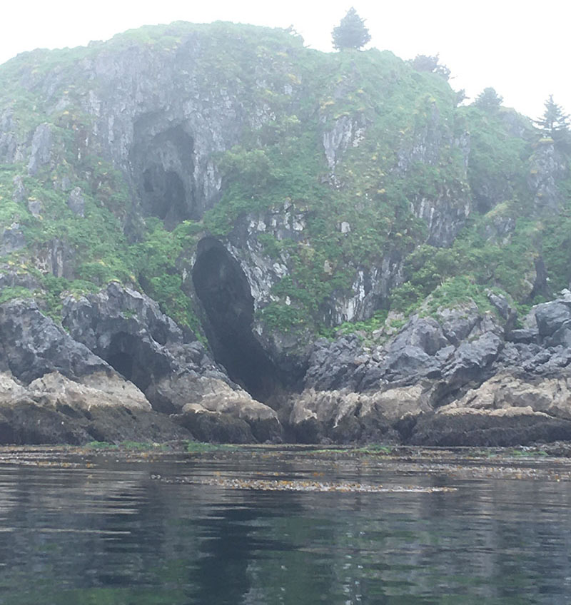 Caves on the shoreline of Divers Island off the west coast of Dall Island, seen during the first year of fieldwork for the Our Submerged Past expedition.