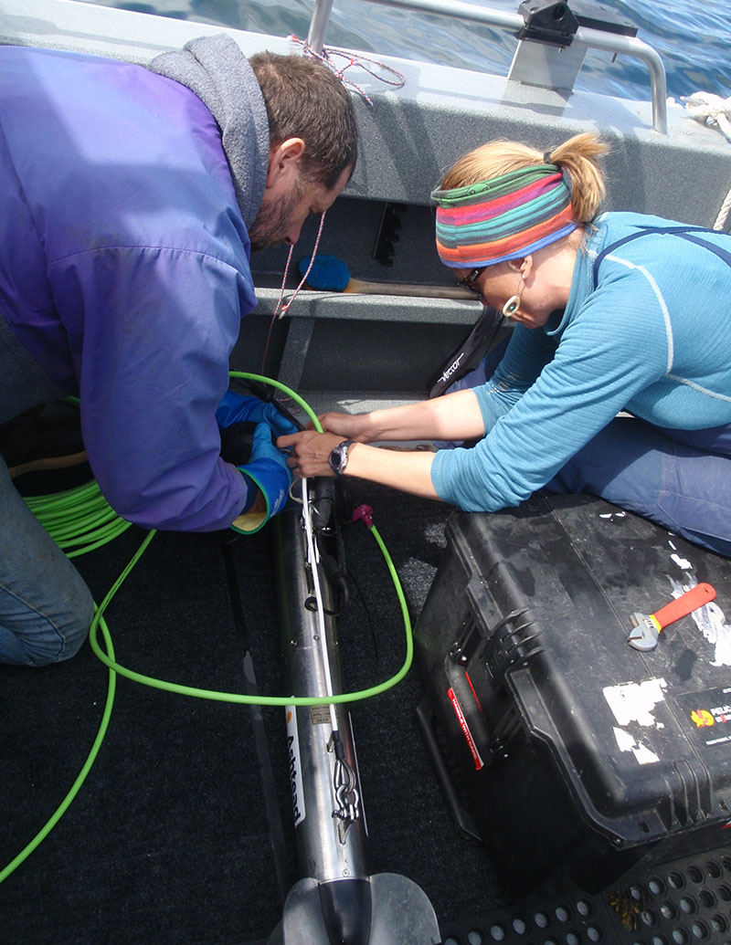 Vickie Siegel and Brant Baxter setting up the sidescan sonar fish for a survey during Year 1 of the Our Submerged Past expedition.