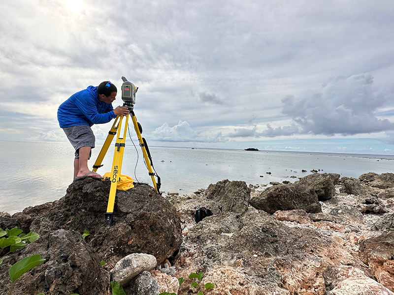 A project team member collecting high-resolution coastal elevation data using a Trimble SX10 scanning total station.