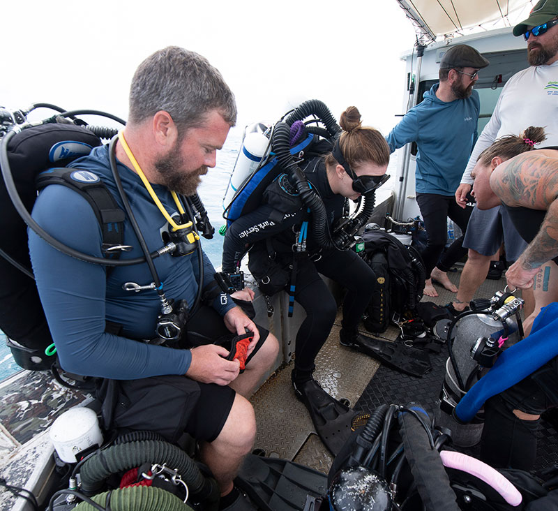 Divers prepare for a dive in the Asan unit of War in the Pacific National Historical Park.