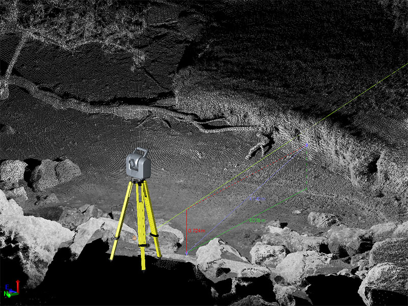 A scanning total station on boulders on the shoreline of Agat facing inland. Using very high-resolution lidar like this enables researchers to measure features and parameters of interest, including erosion of the bank at the shoreline.