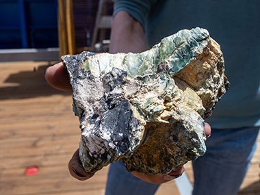 A large rock with serpentine mineralization collected during the In Search of Lost Hydrothermal Cities expedition.