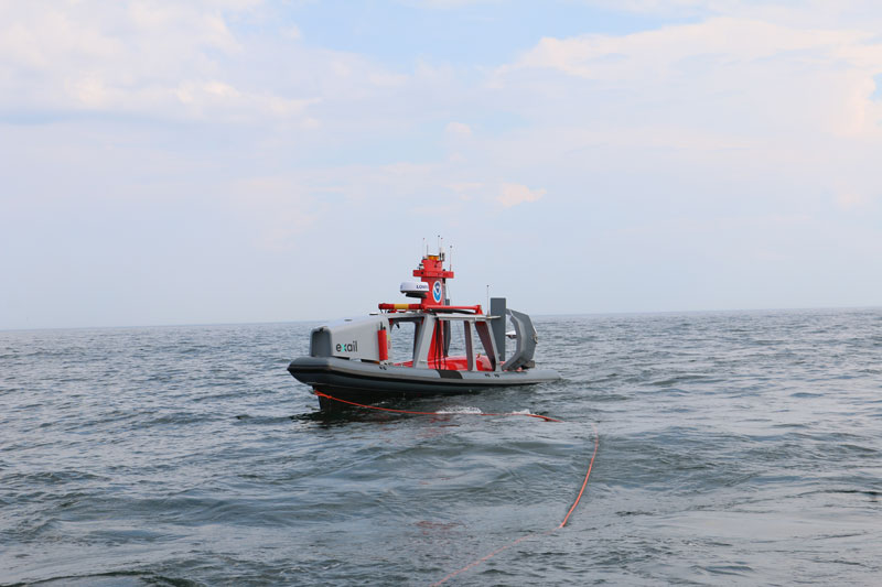 A DriX uncrewed surface vehicle sits in its deployment system pre-survey.