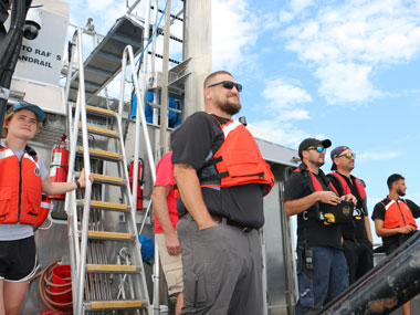 A team of operators from the government, academia, and industry observe DriX operations.