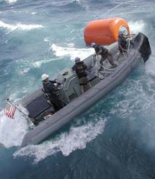crew in rigid inflatable boat in heavy seas